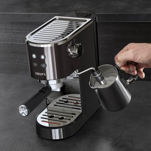 Machine à expresso Krups Virtuoso Essential - 15 bars. Acier inoxydable noir. Design compact et élégant. Arrêt automatique. Expresso et cappuccino. Thermobloc. Buse vapeur. Doseur inclus. XP4418